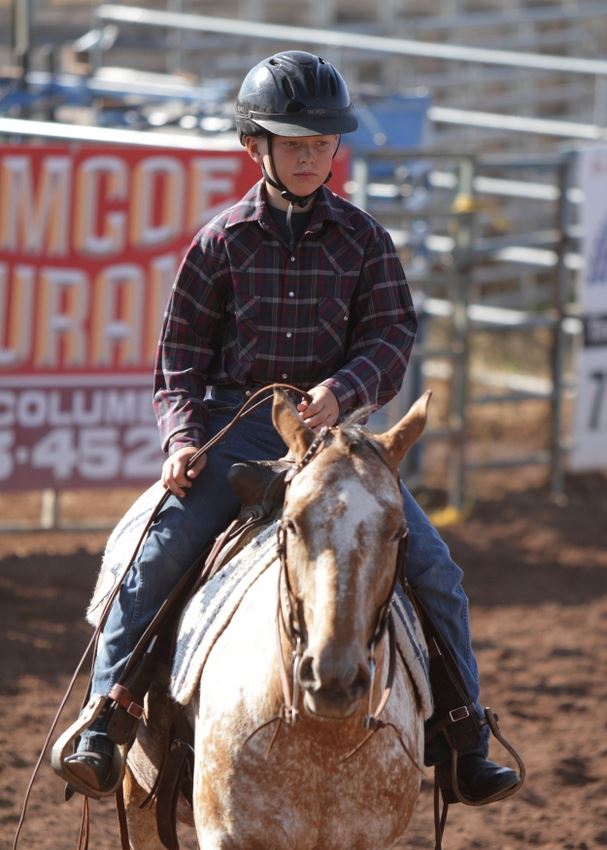 A boy rides his horse in the arena at the 2014 Klickitat County Fair.
