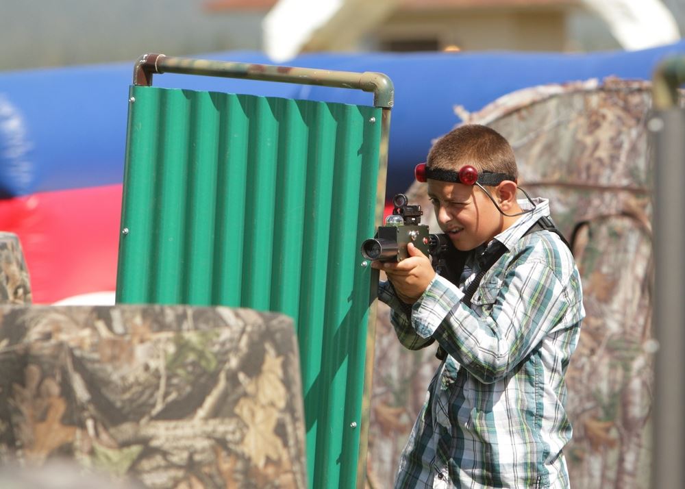 A little boy plays laser tag at the 2014 Klickitat County Fair.