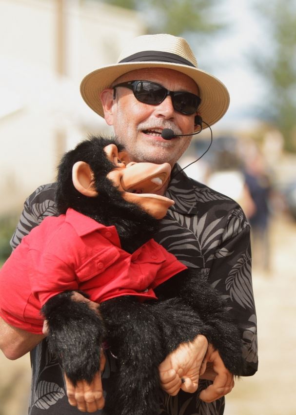 A man with a chimpanzee puppet performs at the 2014 Klickitat County Fair.