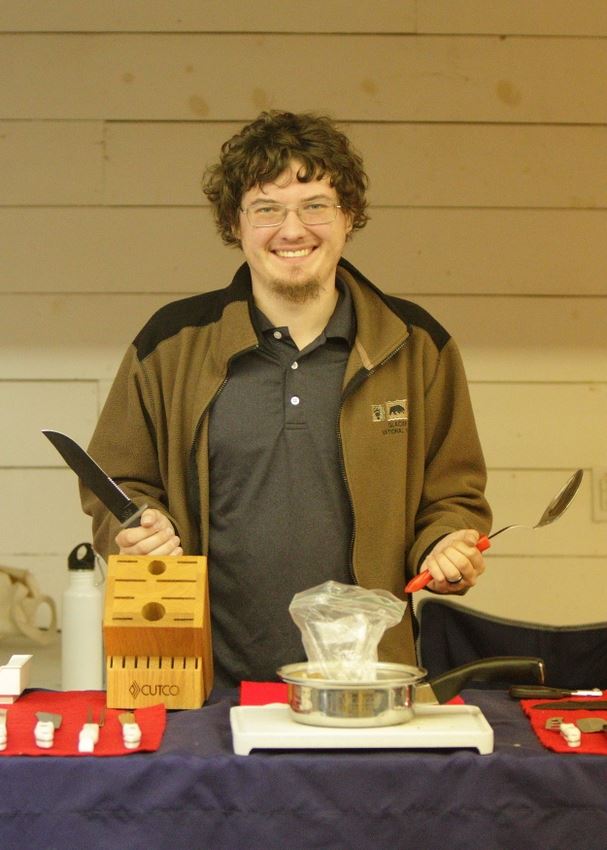 A man shows Cutco products at the 2014 Klickitat County Fair.