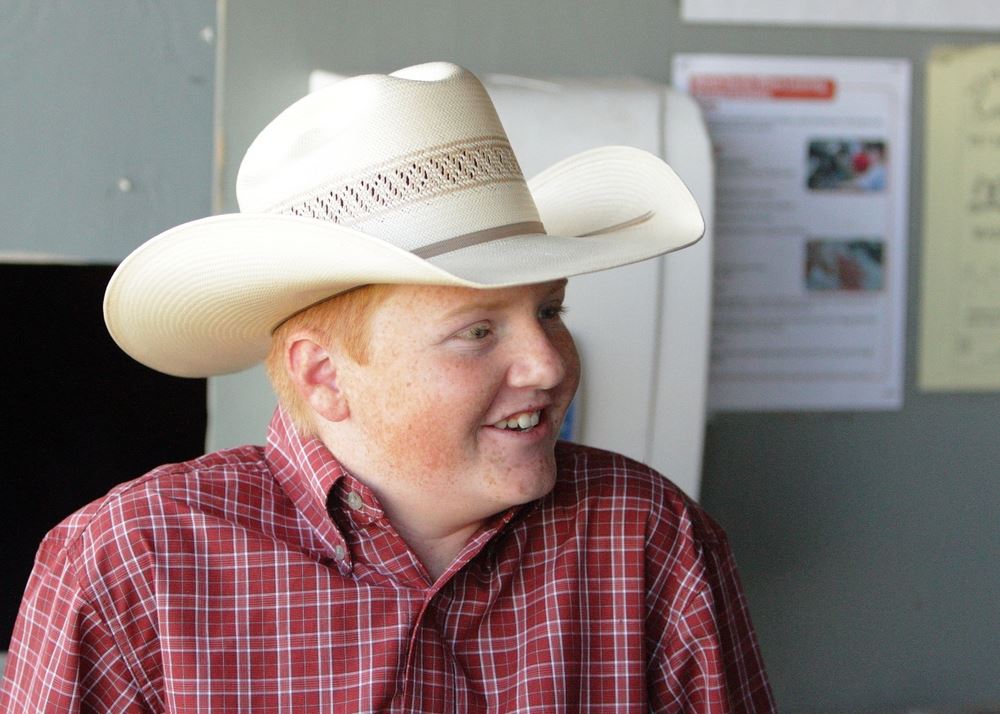 A young man wearing a cowboy hat attends the 2014 Klickitat County Fair.