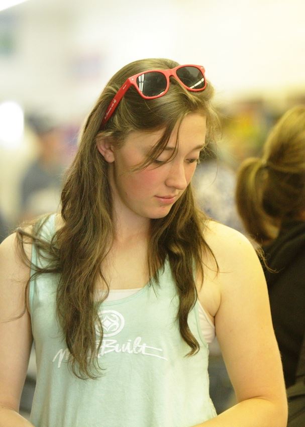 A girl stands among the crowd at the 2014 Klickitat County Fair.