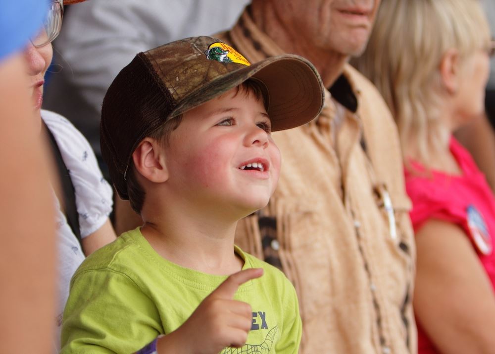 A little boy looks up in amusement at the 2014 Klickitat County Fair.