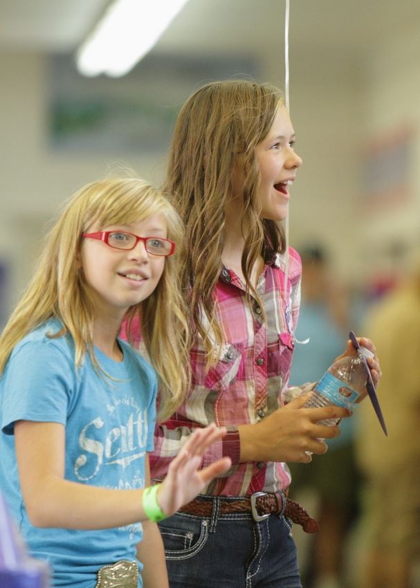 Two girls smile at the 2014 Klickitat County Fair.