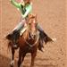 A rodeo queen rides by on her horse and waves to the crowd at the 2014 Klickitat County Fair Rodeo.