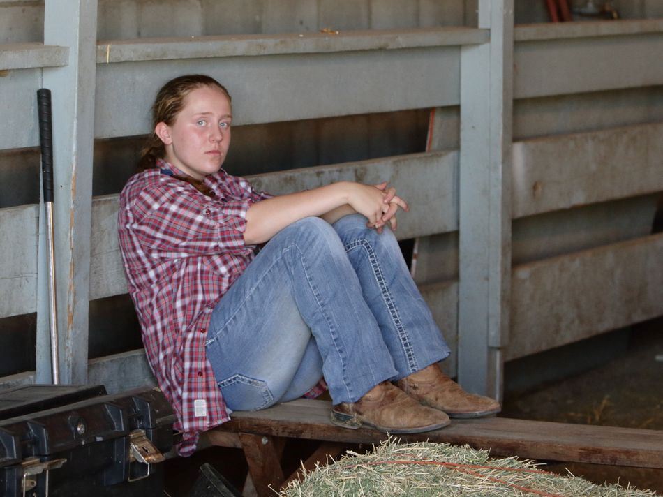 A girl takes a break between events at the 2015 Klickitat County Fair.