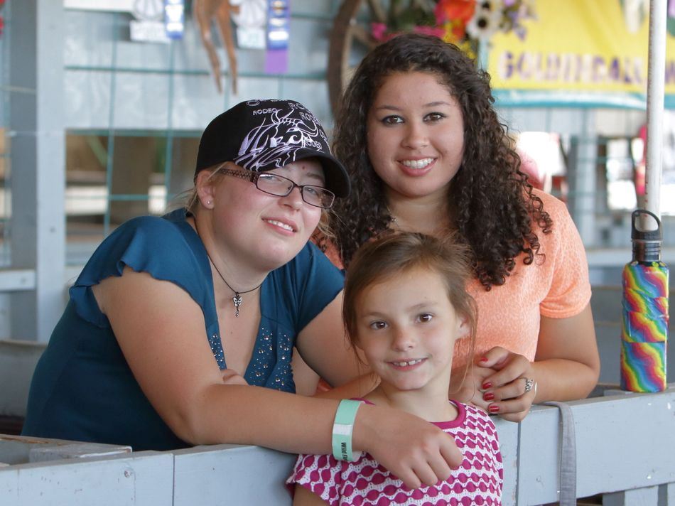 Three girls enjoy the Klickitat County  Fair.