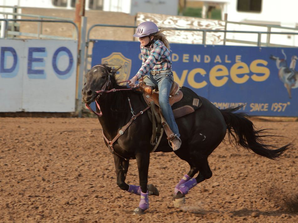 A little girl runs her horse at the 2015 Klickitat County Fair.