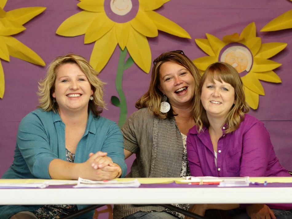 Three women sit together at the 2015 Klickitat County Fair.