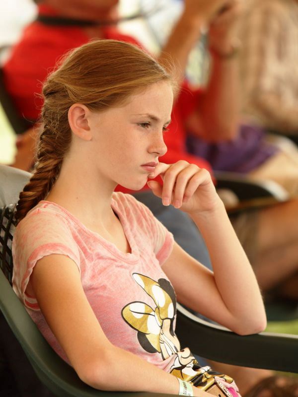 A young woman watches an event at the 2015 Klickitat County Fair.