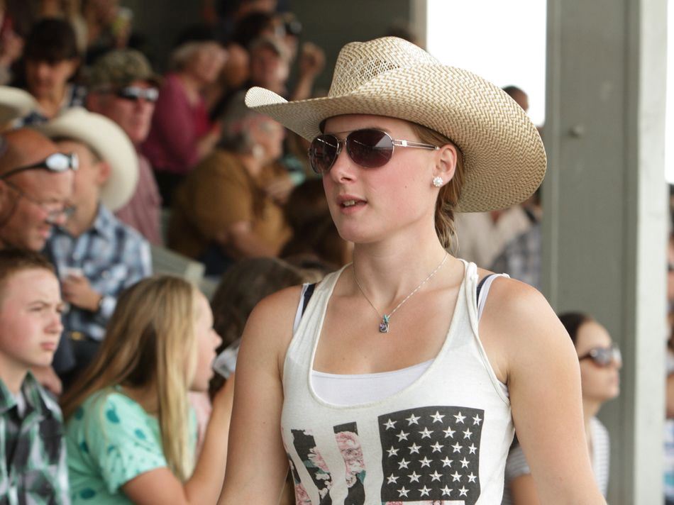 A girl walks next to the crowd at the 2015 Klickitat County Fair.