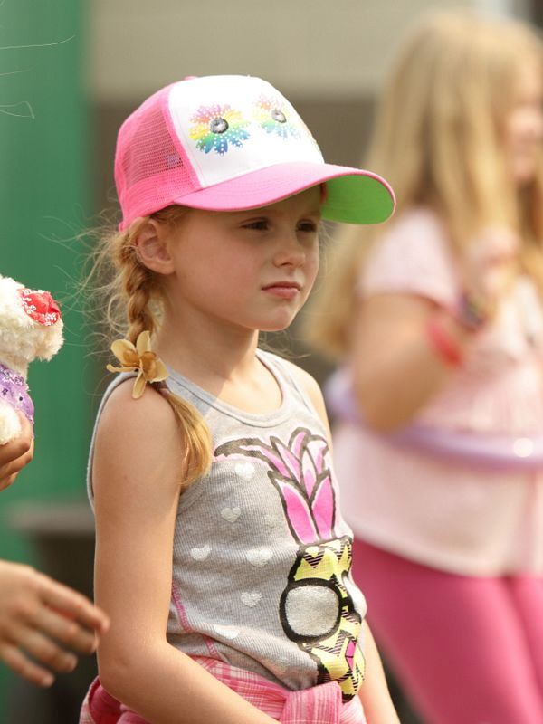 A little girl stands in among the crowd at the 2015 Klickitat County Fair.