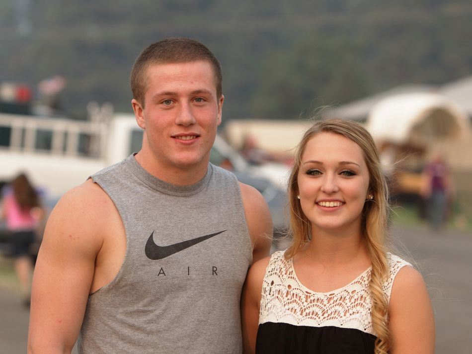 A young man and young woman stand together at the 2015 Klickitat County Fair.