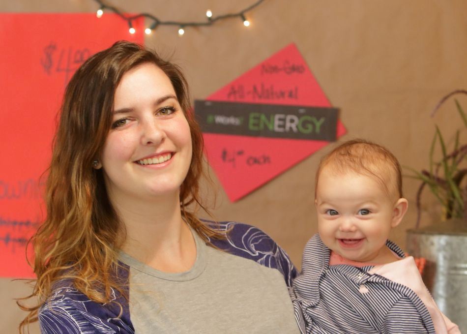 A woman holds a smiley baby at the 2015 Klickitat County Fair.