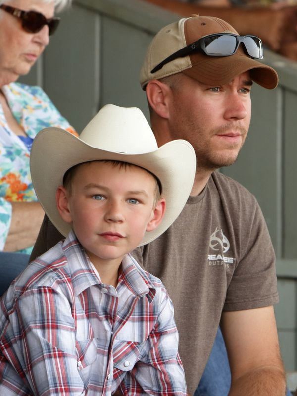 A boy sits among the crowd at the 2015 Klickitat County Fair.