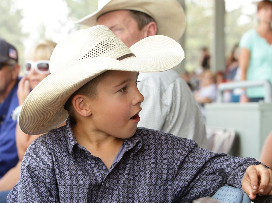 A boy chats with another member of the crowd at the 2015 Klickitat County Fair.